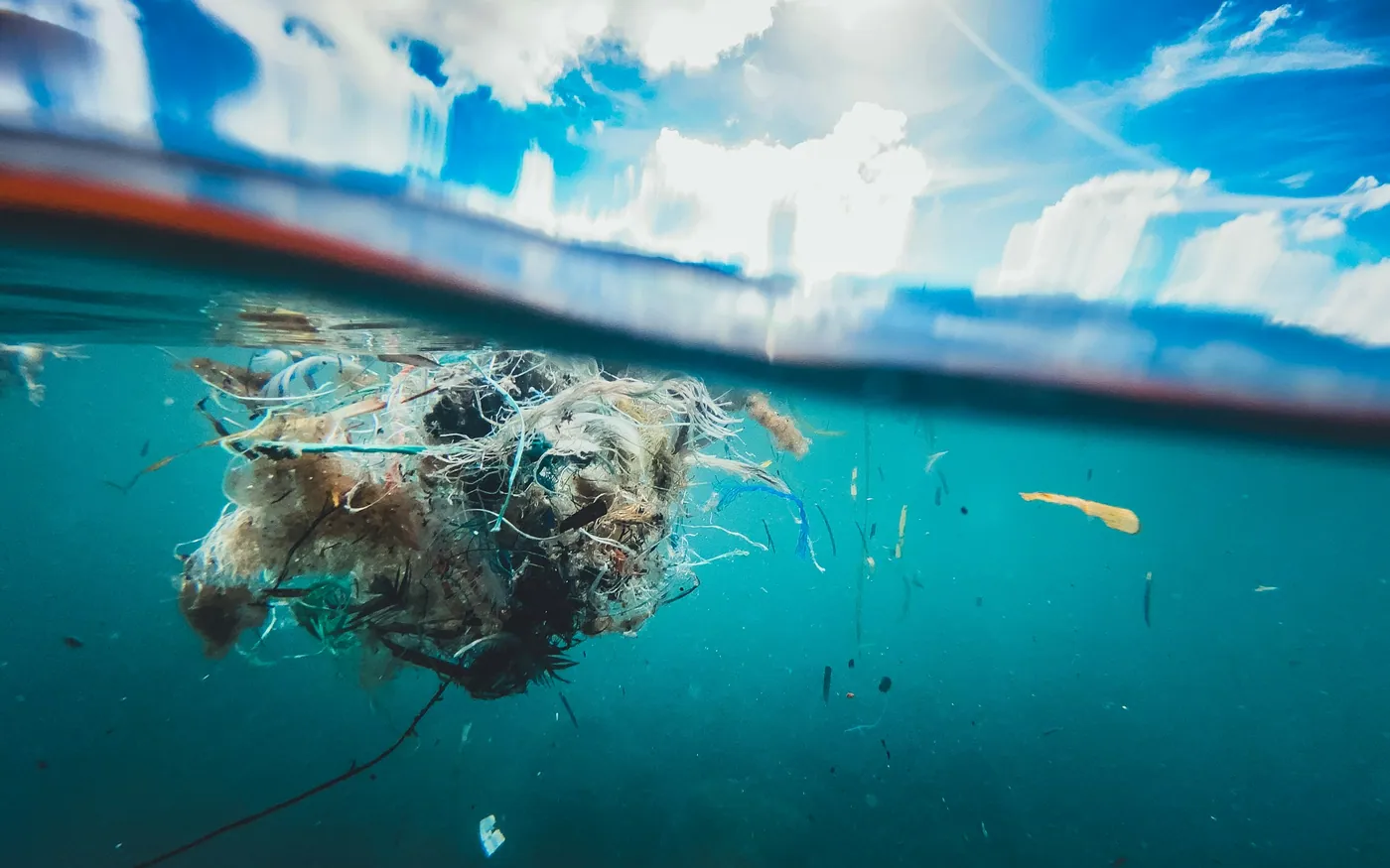 A matted ball of discarded net and rope floating just below the surface