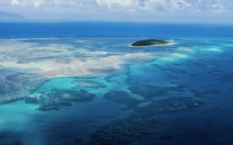 A shallow reef and small island photographed from above
