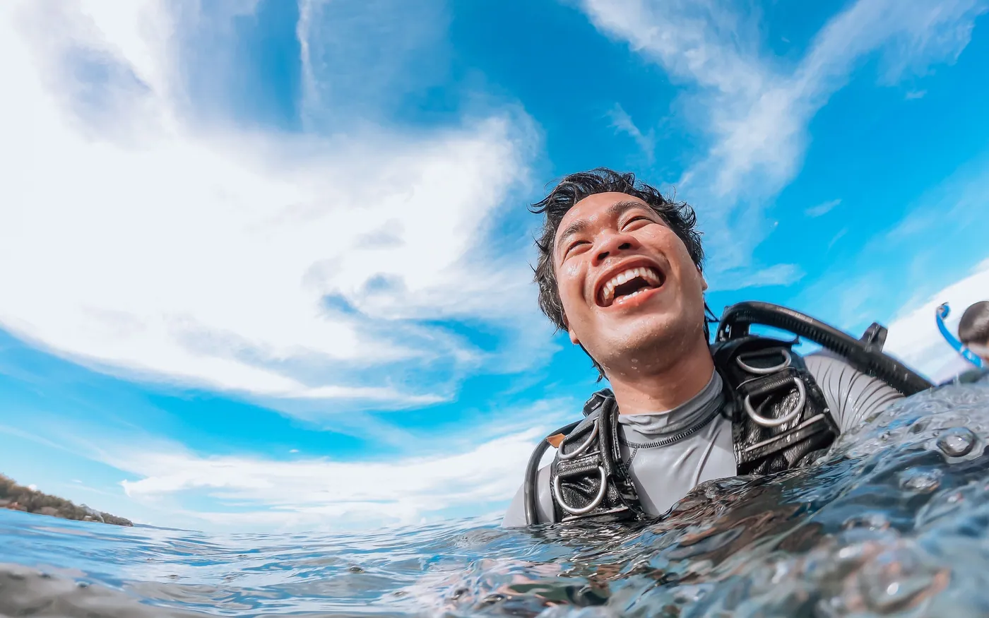 A diver floating comfortably at the surface with the buoyancy device inflated