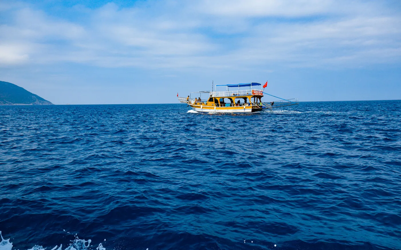 A small dive boat under way across open water