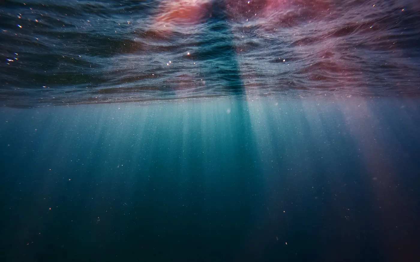 Sunlight through the surface seen from below during a descent