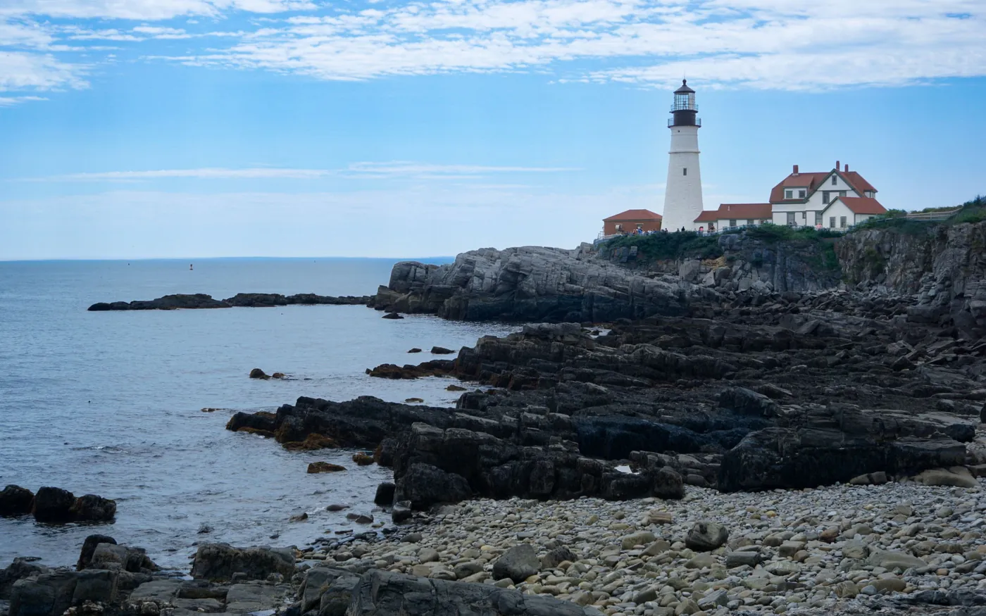 Portland Head Light standing above the rocky Maine shoreline
