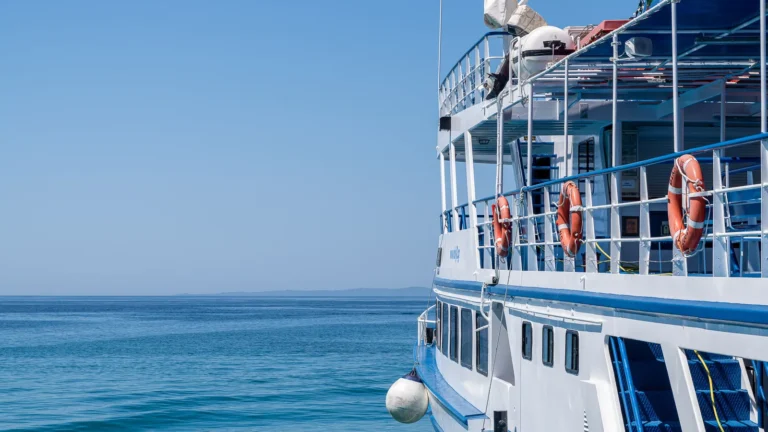 The side deck of a dive boat with liferings along the rail