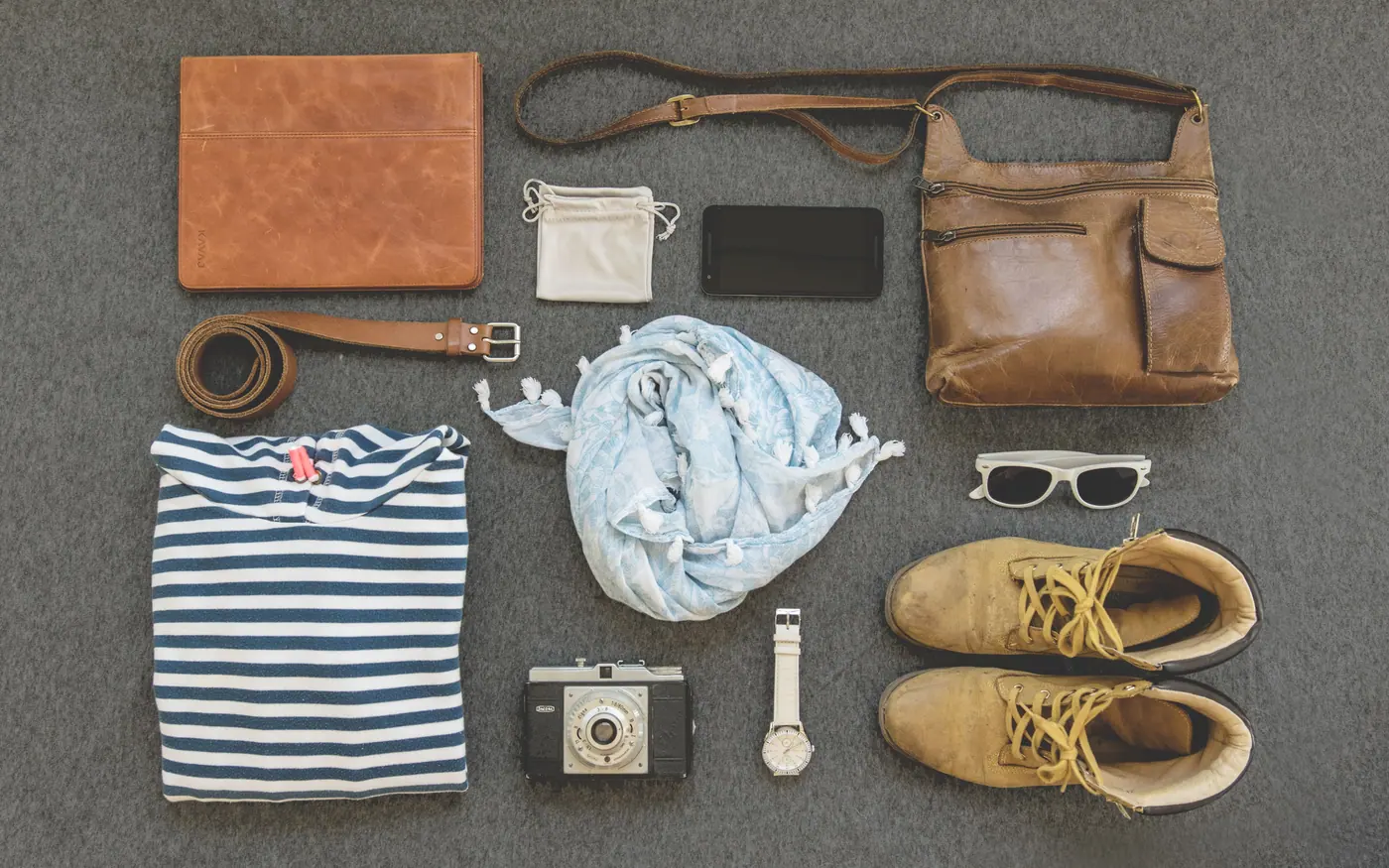 Travel essentials laid out flat before being packed